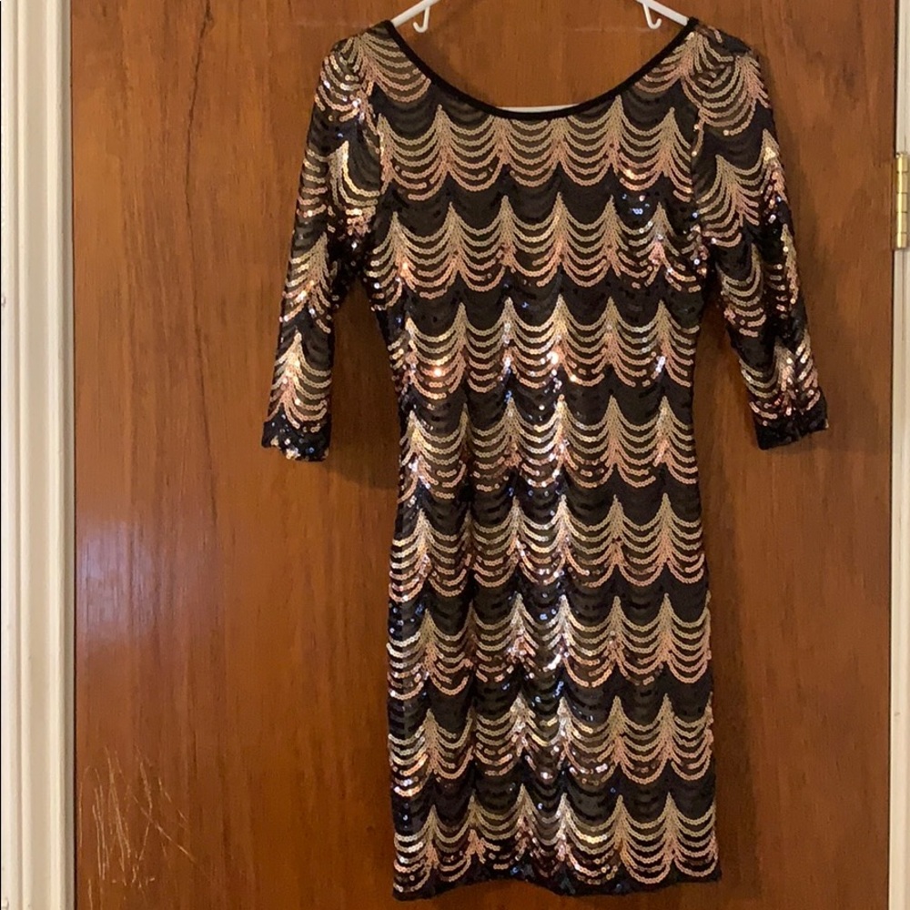 Long sleeve, open back dress